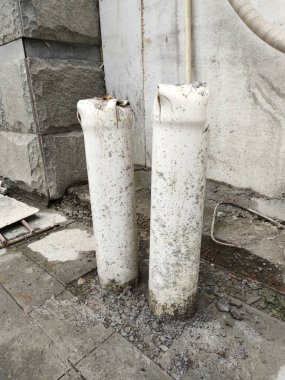 Pvc pipe plumbing installation that comes out of the floor, preparation for floor drain installation.