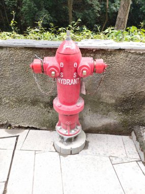 Hydrant pillar in the outside area, for fire fighting. Bali - Indonesia ; December 17, 2022.
