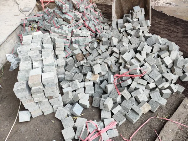 pile of cobblestone ready to be installed. cobblestone with a size of 10 cm x 10 cm x 5 cm.