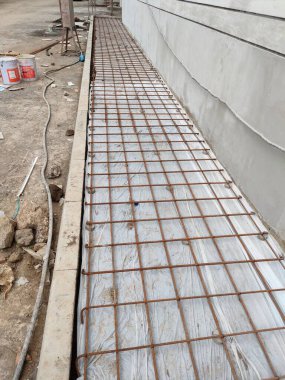 installation of sheet plastic and wire mesh, for external flooring. ready to be poured concrete.