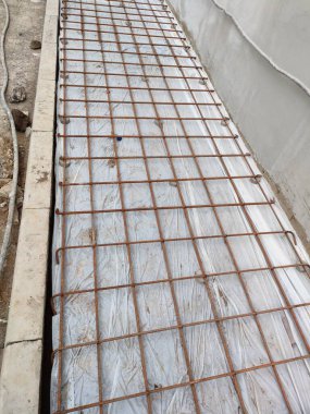 installation of sheet plastic and wire mesh, for external flooring. ready to be poured concrete.
