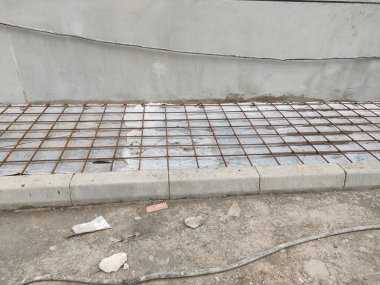 installation of sheet plastic and wire mesh, for external flooring. ready to be poured concrete.