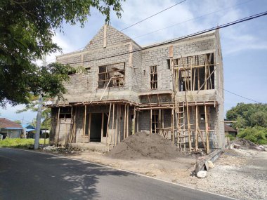 the front view of the house building project, still looks brick. Bali - Indonesia ; January 4, 2023.