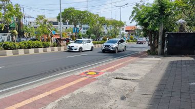 the traffic on the street was light, after last night's new years event. Bali - Indonesia ; January 1, 2023.