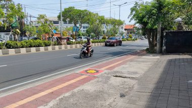 the traffic on the street was light, after last night's new years event. Bali - Indonesia ; January 1, 2023.