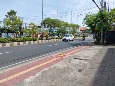 the traffic on the street was light, after last night's new years event. Bali - Indonesia ; January 1, 2023.