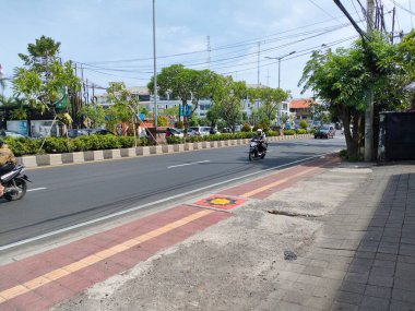 the traffic on the street was light, after last night's new years event. Bali - Indonesia ; January 1, 2023.