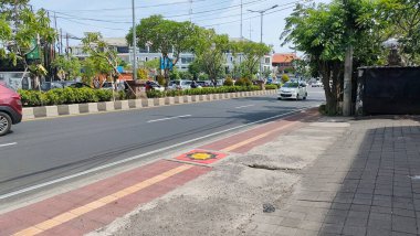 the traffic on the street was light, after last night's new years event. Bali - Indonesia ; January 1, 2023.