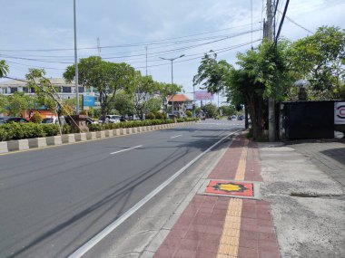 the traffic on the street was light, after last night's new years event. Bali - Indonesia ; January 1, 2023.