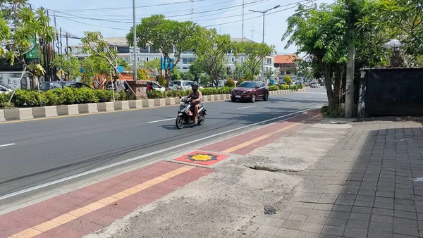 the traffic on the street was light, after last night's new years event. Bali - Indonesia ; January 1, 2023.