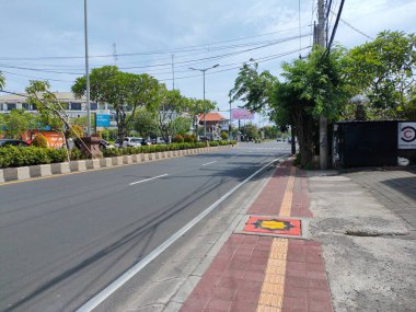 the traffic on the street was light, after last night's new years event. Bali - Indonesia ; January 1, 2023.