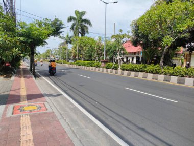 the traffic on the street was light, after last night's new years event. Bali - Indonesia ; January 1, 2023.