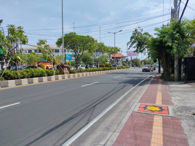 the traffic on the street was light, after last night's new years event. Bali - Indonesia ; January 1, 2023.