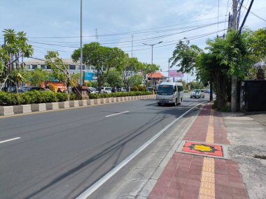 the traffic on the street was light, after last night's new years event. Bali - Indonesia ; January 1, 2023.
