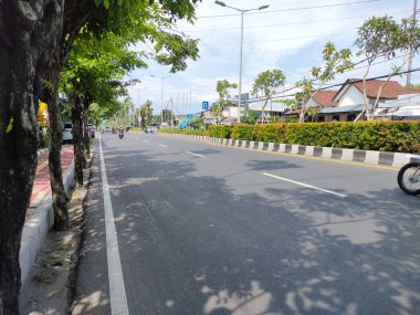 the traffic on the street was light, after last night's new years event. Bali - Indonesia ; January 1, 2023.