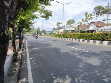 the traffic on the street was light, after last night's new years event. Bali - Indonesia ; January 1, 2023.