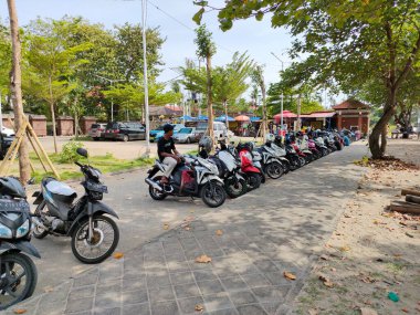 vehicle parking lot on german coast - kuta. Bali - Indonesia ; January 1, 2023.