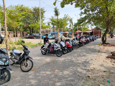 vehicle parking lot on german coast - kuta. Bali - Indonesia ; January 1, 2023.