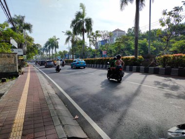 the traffic on the street was light, after last night's new years event. Bali - Indonesia ; January 1, 2023.
