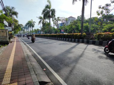 the traffic on the street was light, after last night's new years event. Bali - Indonesia ; January 1, 2023.