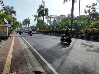 the traffic on the street was light, after last night's new years event. Bali - Indonesia ; January 1, 2023.