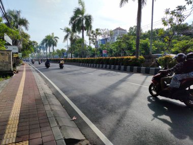 the traffic on the street was light, after last night's new years event. Bali - Indonesia ; January 1, 2023.