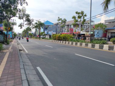 the traffic on the street was light, after last night's new years event. Bali - Indonesia ; January 1, 2023.