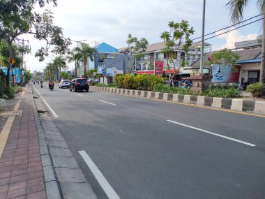 the traffic on the street was light, after last night's new years event. Bali - Indonesia ; January 1, 2023.