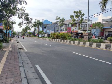 the traffic on the street was light, after last night's new years event. Bali - Indonesia ; January 1, 2023.