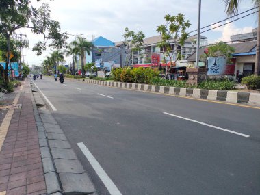the traffic on the street was light, after last night's new years event. Bali - Indonesia ; January 1, 2023.