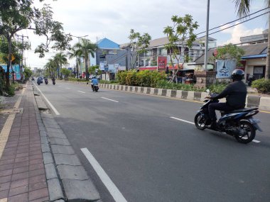the traffic on the street was light, after last night's new years event. Bali - Indonesia ; January 1, 2023.