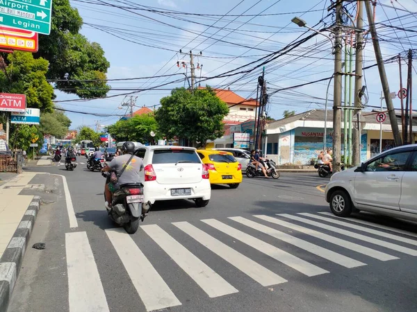 normal and smooth traffic at the intersection of Jalan Raya Kuta. Bali - Indonesia ; January 3, 2023.