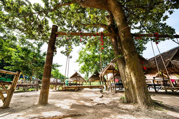 Wood swing with hut beside Huay Tung Tao Lake, Chiang Mai Province.