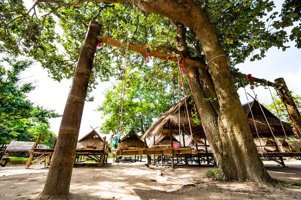 Wood swing with hut beside Huay Tung Tao Lake, Chiang Mai Province.