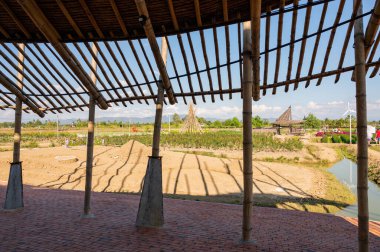 Bamboo building with flower garden in Chiangmai province, Thailand.