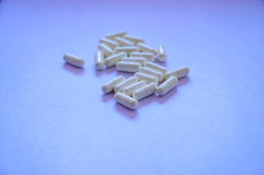 Medical White Capsules on White Background, Thailand.