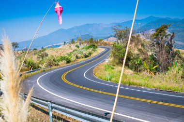 Winding and steep road in Nan province, Thailand.