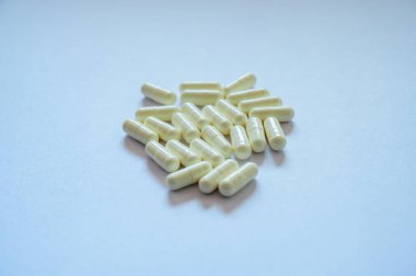 Medical White Capsules on White Background, Thailand.