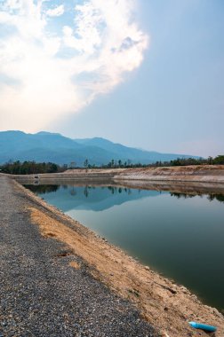 Reservoir with mountain view in Chiang Mai province, Thailand.