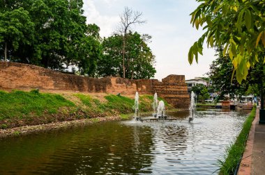 CHIANG MAI, THAILAND - April 26, 2020 : Chaeng Si Phum ancient wall with city street, Chiang Mai province.