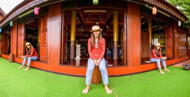 Pamorama of triple Asian women with old building background at Phayao province, Thailand.