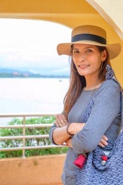 Asia Woman Traveler with Golden Triangle Background, Chiang Rai Province.