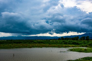 Kwan Phayao lake with rainy clouds, Thailand.