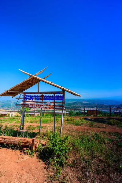 Wooden bridge with scenic view at Doi Sa Ngo viewpoint, Chiang Rai province.