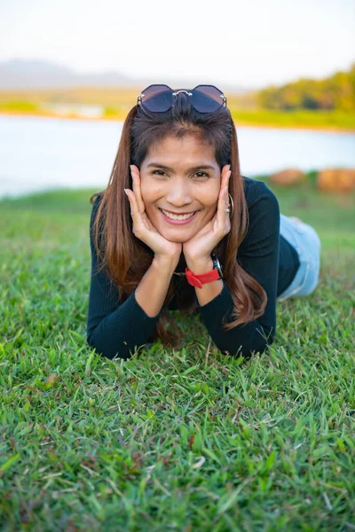 Asia woman on the grass, Thailand.