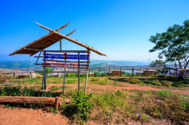 Wooden bridge with scenic view at Doi Sa Ngo viewpoint, Chiang Rai province.