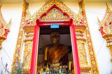 LAMPHUN, THAILAND - December 10, 2019 : Ancient Buddha statue in Phra That Hariphunchai temple, Lamphun province.