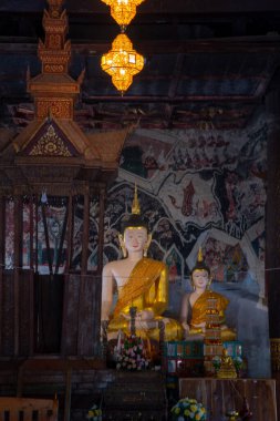 Beautiful Buddha with ancient wall painting in Rong Ngae temple, Thailand.