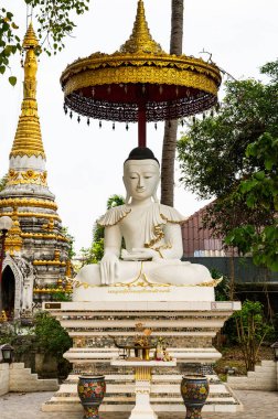 White Buddha statue of Sri Rong Muang temple in Lampang province, Thailand.