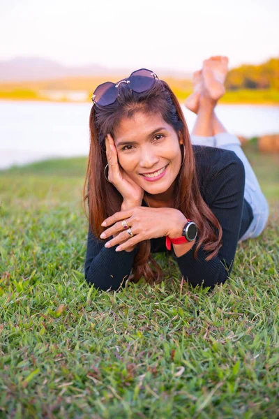 Asia woman on the grass, Thailand.